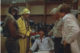 The team interrogates a sweatshop guy
