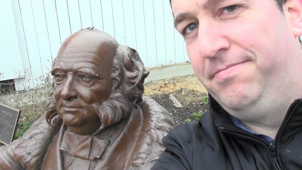 Brady with a statue of Martin Van Buren