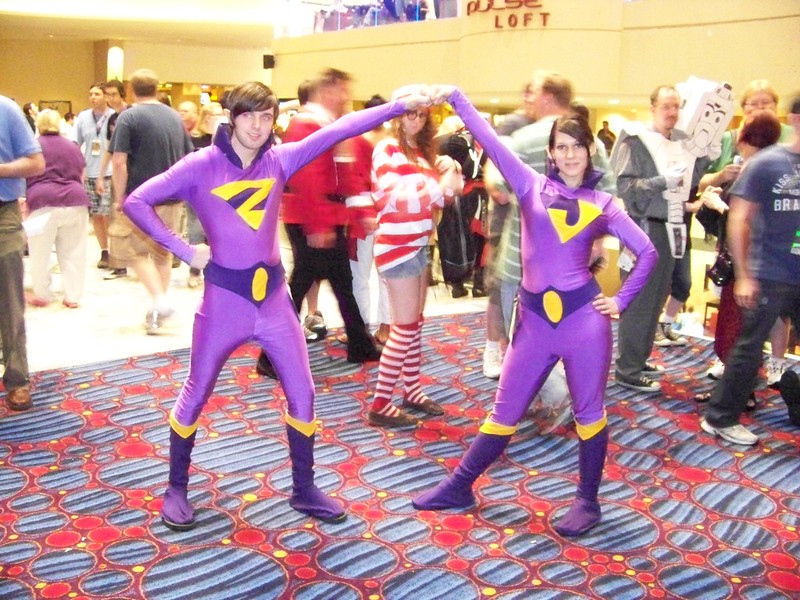 A pair cosplaying the Wonder Twins, complete with bright purple suits and boots, at Dragon*Con 2010. (Photo by WyldKyss via Flickr/Creative Commons https://flic.kr/p/8z5TTu)