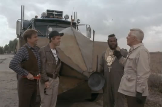The team admires its new armor-plated semi-truck
