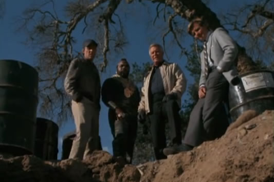 The A-Team looking at a hole in the ground