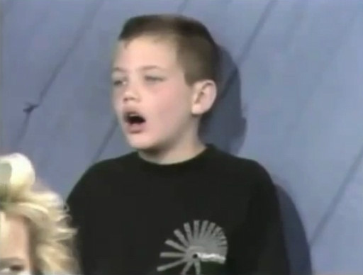 Kid watches whistling guy
