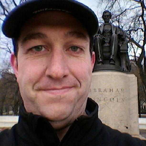 Brady with a statue of Abraham Lincoln in Chicago's Grant Park.