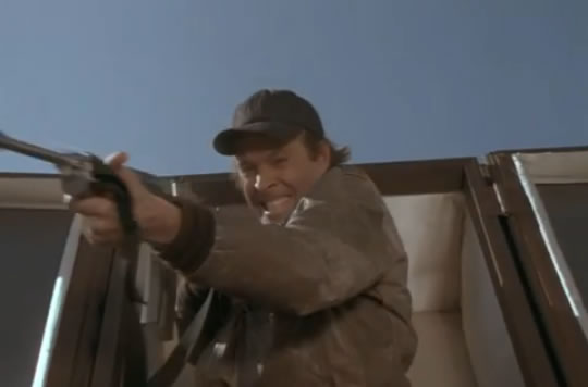 Murdock and a machine gun inside a casket