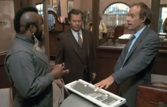 B.A. and Murdock try their computer scam at the bank