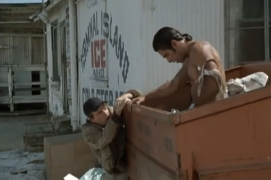 Frankie is in a dumpster with no pants.