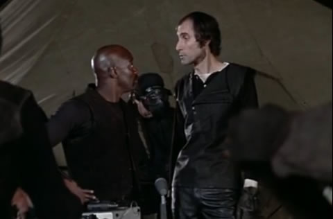 A horsey guy yells at Duke from Rocky