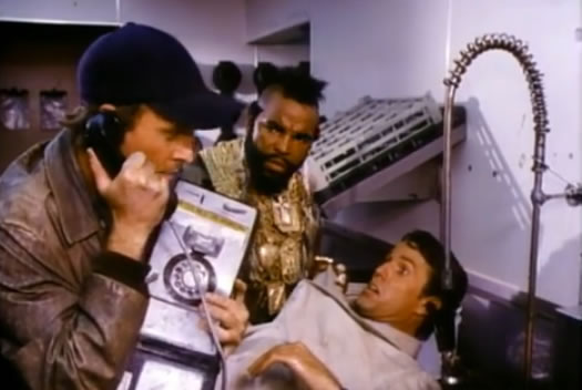 Murdock answers a fake phone as B.A. puts a lawyer under a faucet