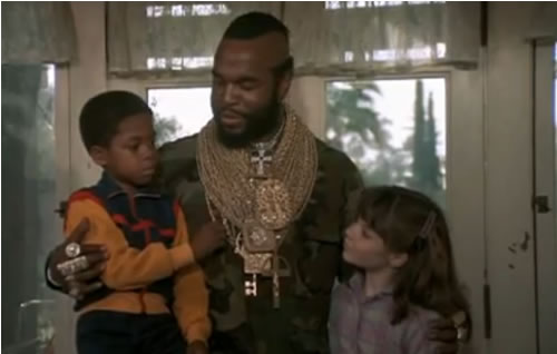 B.A. smiles with some kids