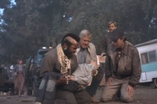 B.A. holds up the unconscious Ole