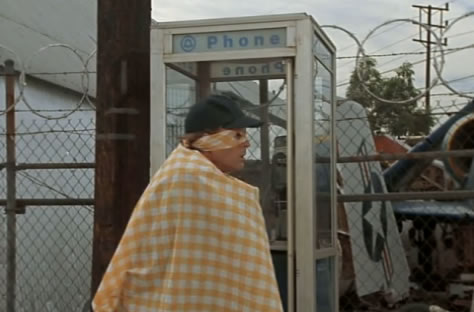 Captain Cab emerges from the phone booth