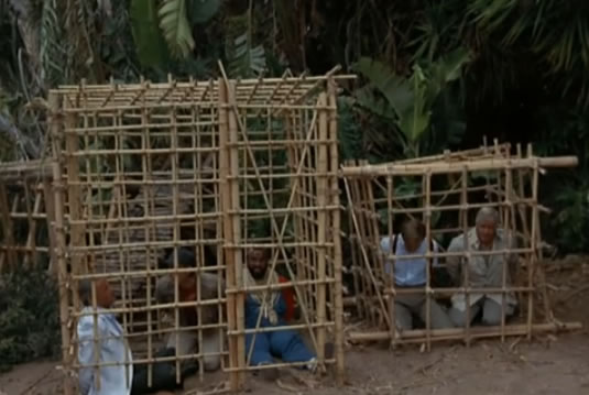 The team and Dr. Richter in wooden cages