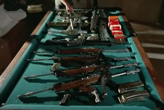 Guns on a pool table