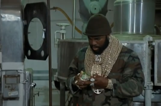 B.A. looks at his sandwich