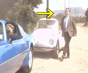 indiana A guy gets out of a car, with mountains in the background