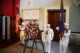 Members of the US Navy stand next to the wreath for John Quincy Adams. 