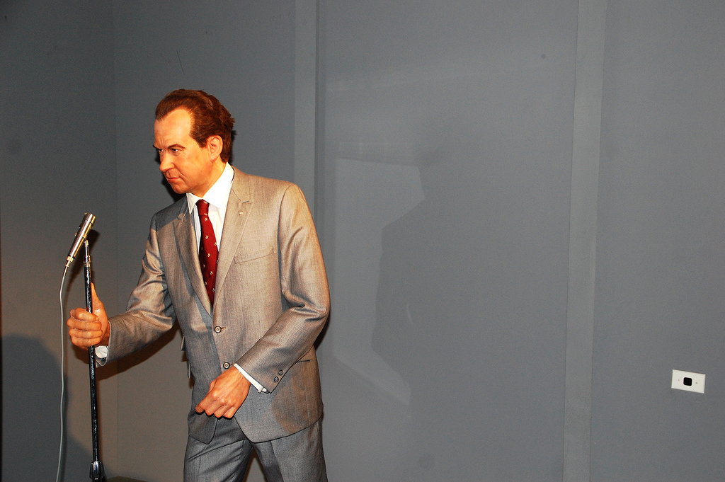 a wax statue of Richard Nixon talks into a microphone