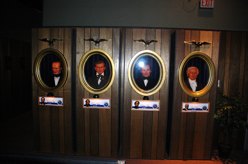 A bunch of presidents' heads in tall vertical boxes with windows in front of the heads (!)