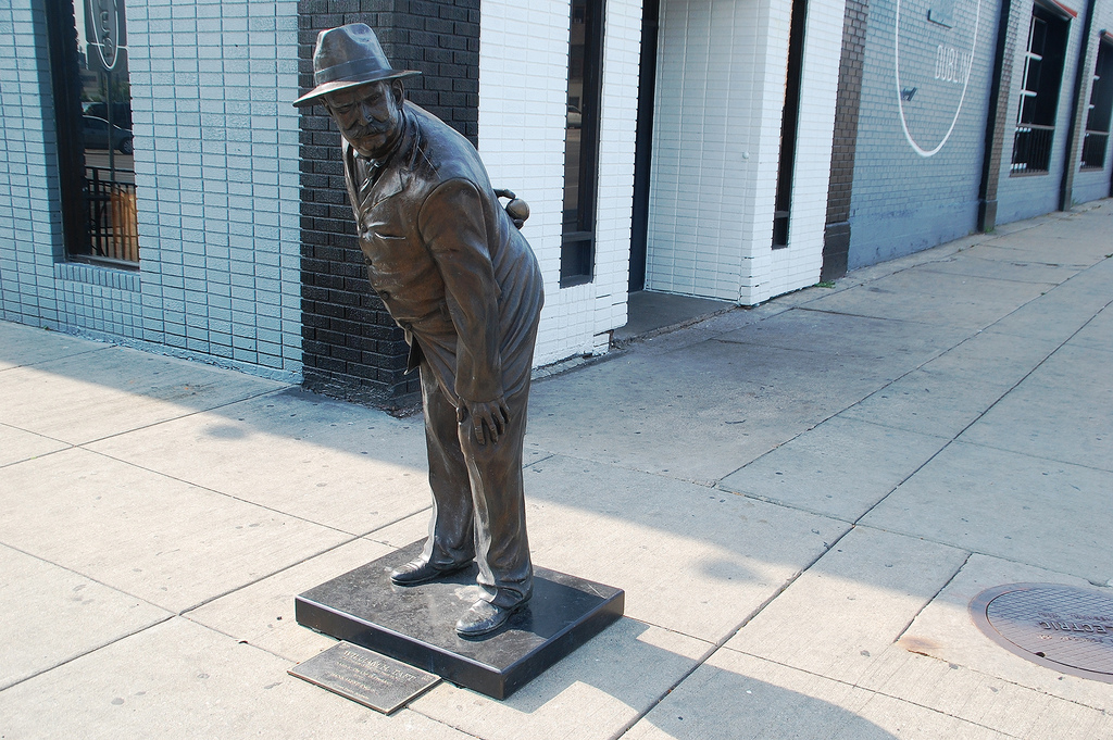 A statue of William Taft prepares to throw a baseball