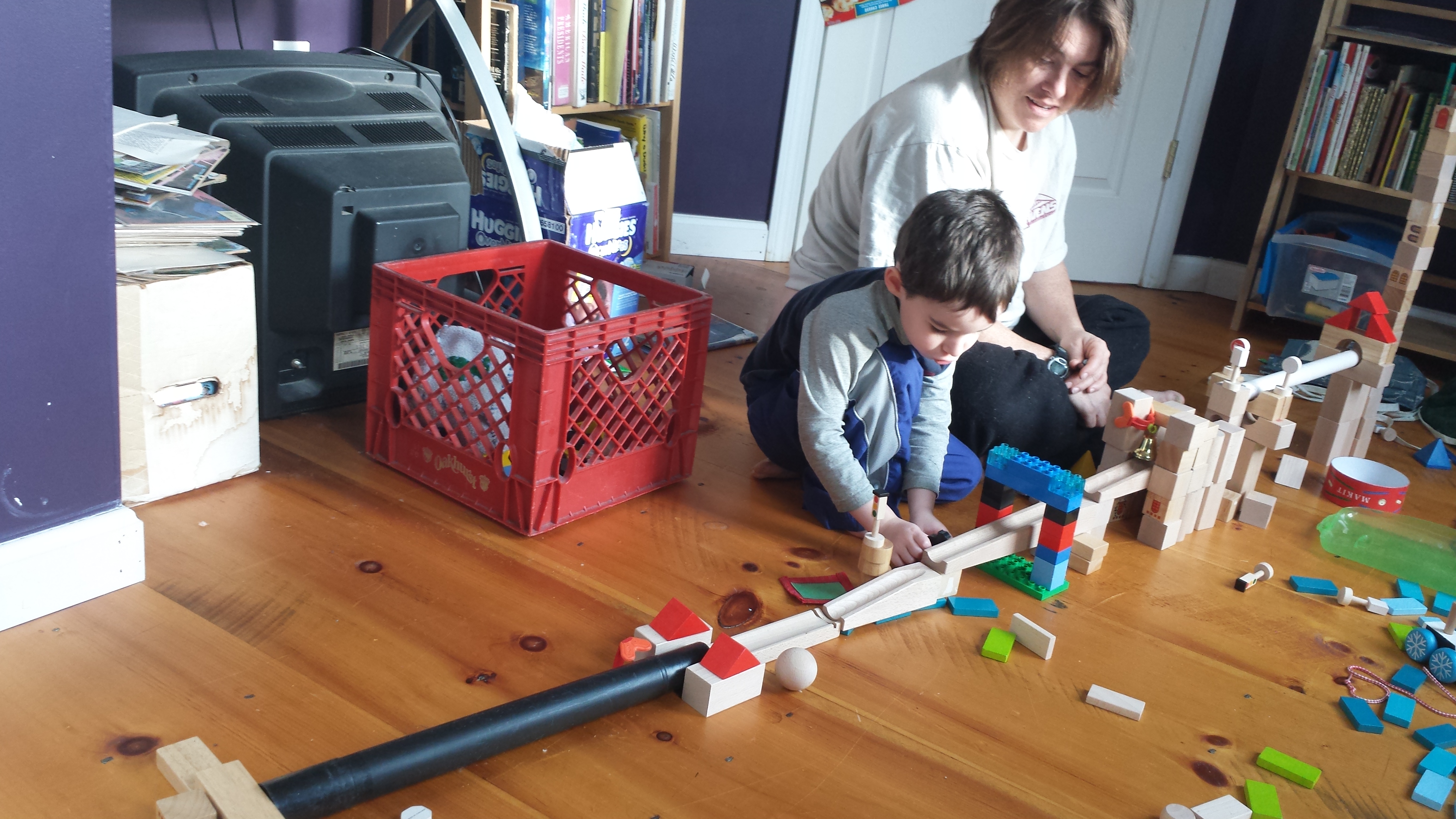 Owen and Sonya make a marble track.