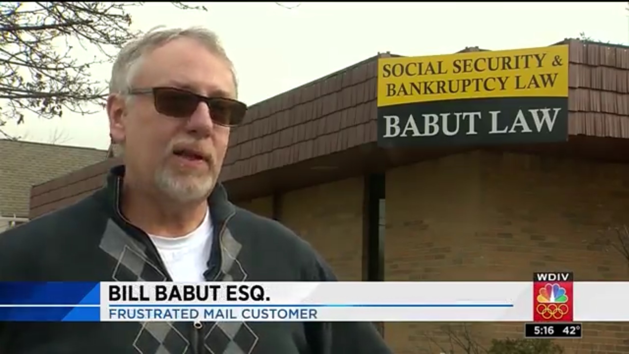 Bill Babut Esq.: Frustrated Mail Customer. In the background is a sign for "Babut Law"