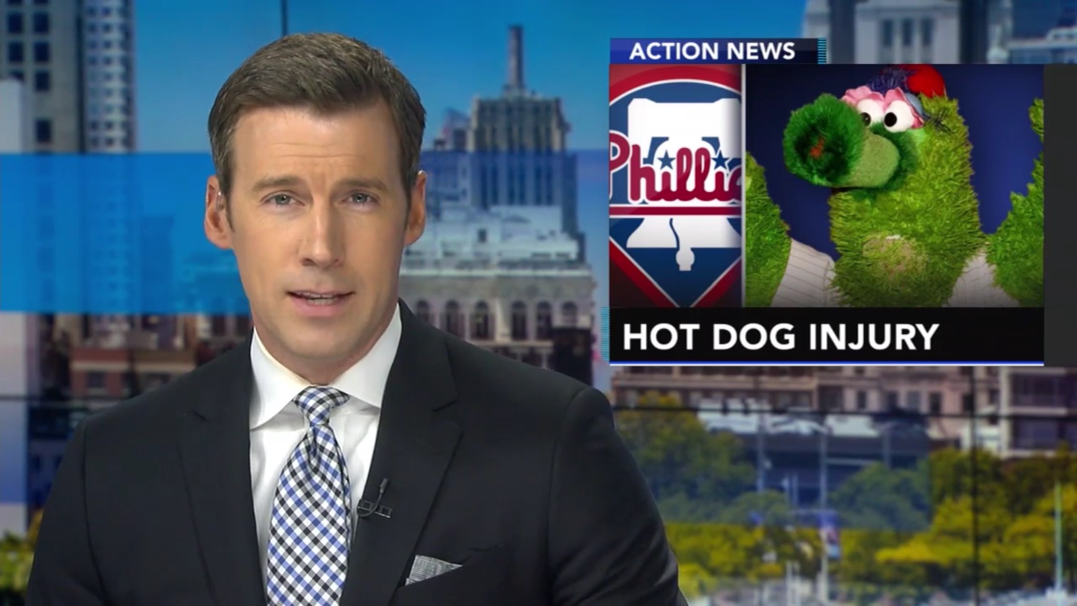 Philly Phanatic on local news with the caption "Hot Dog Injury"