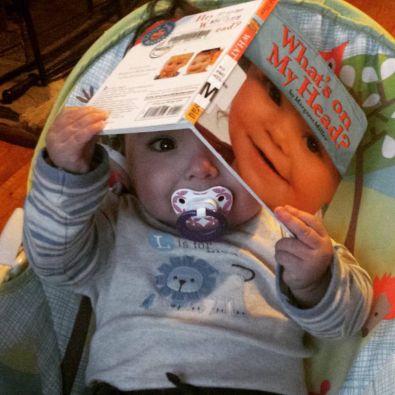Baby boy puts "What's On My Head?" on his head