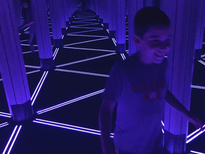 Eight year old in the mirror maze