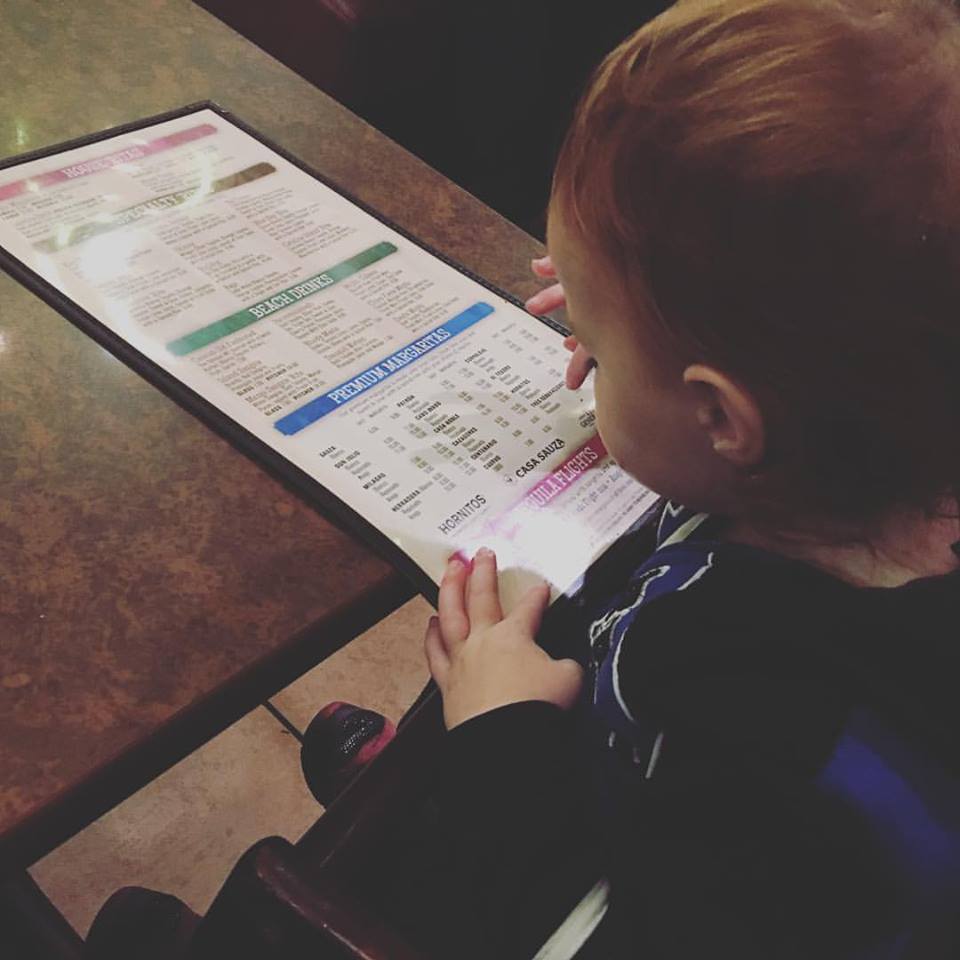 One year old checking out the margarita menu (!)