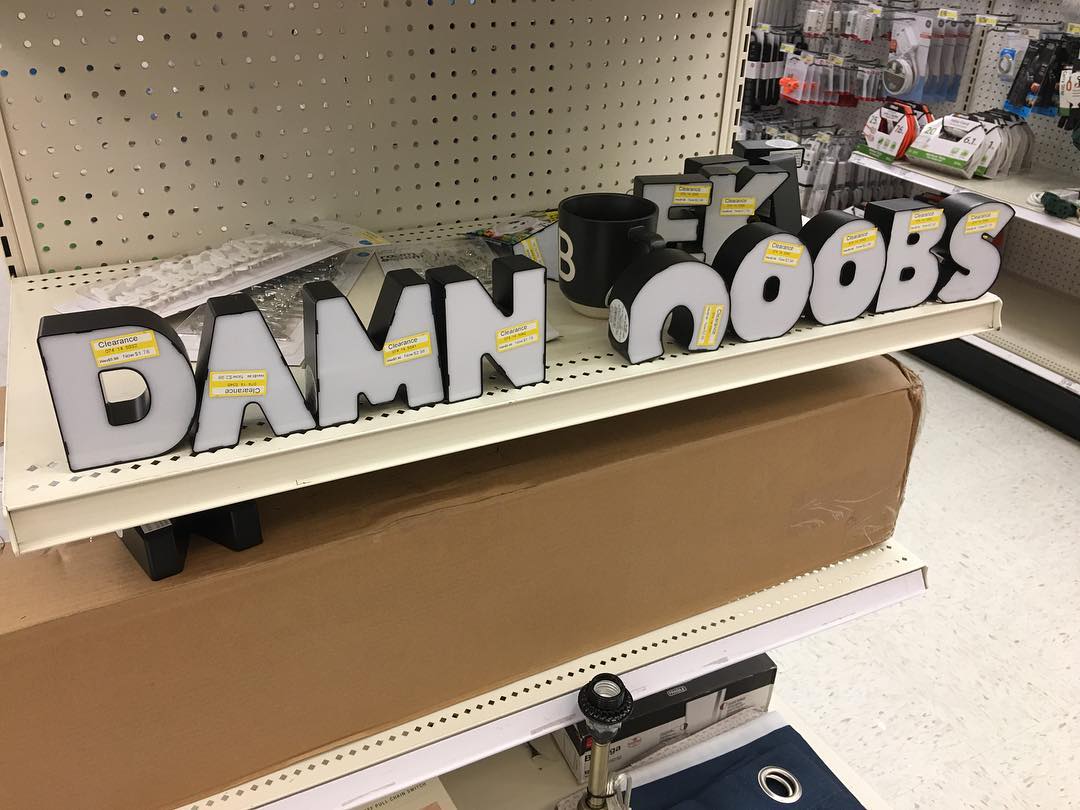 someone took the little lights in the shapes of letters at Target and spelled out "damn noobs"