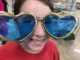 Eight year old in giant heart glasses