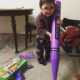 Three year old with his giant purple crayon