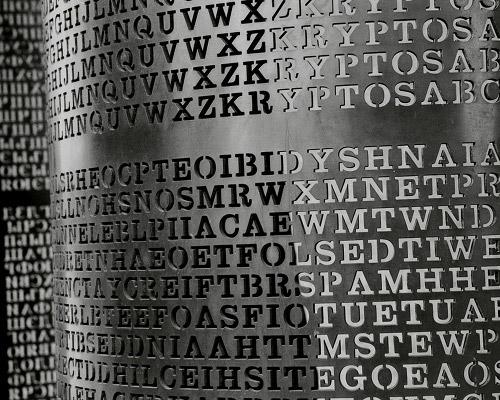 A section of the Kryptos puzzle. Rows of letters punched out of a sheet of curved metal. (Photo by CyberHades via Flickr/Creative Commons https://flic.kr/p/dbczwN)