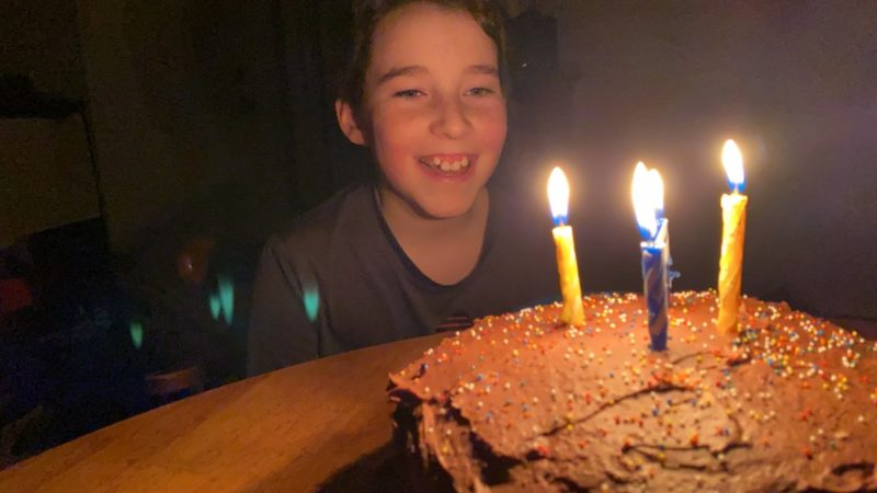 Nine year old and his birthday cake