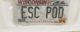 License plate reads "ESC POD"