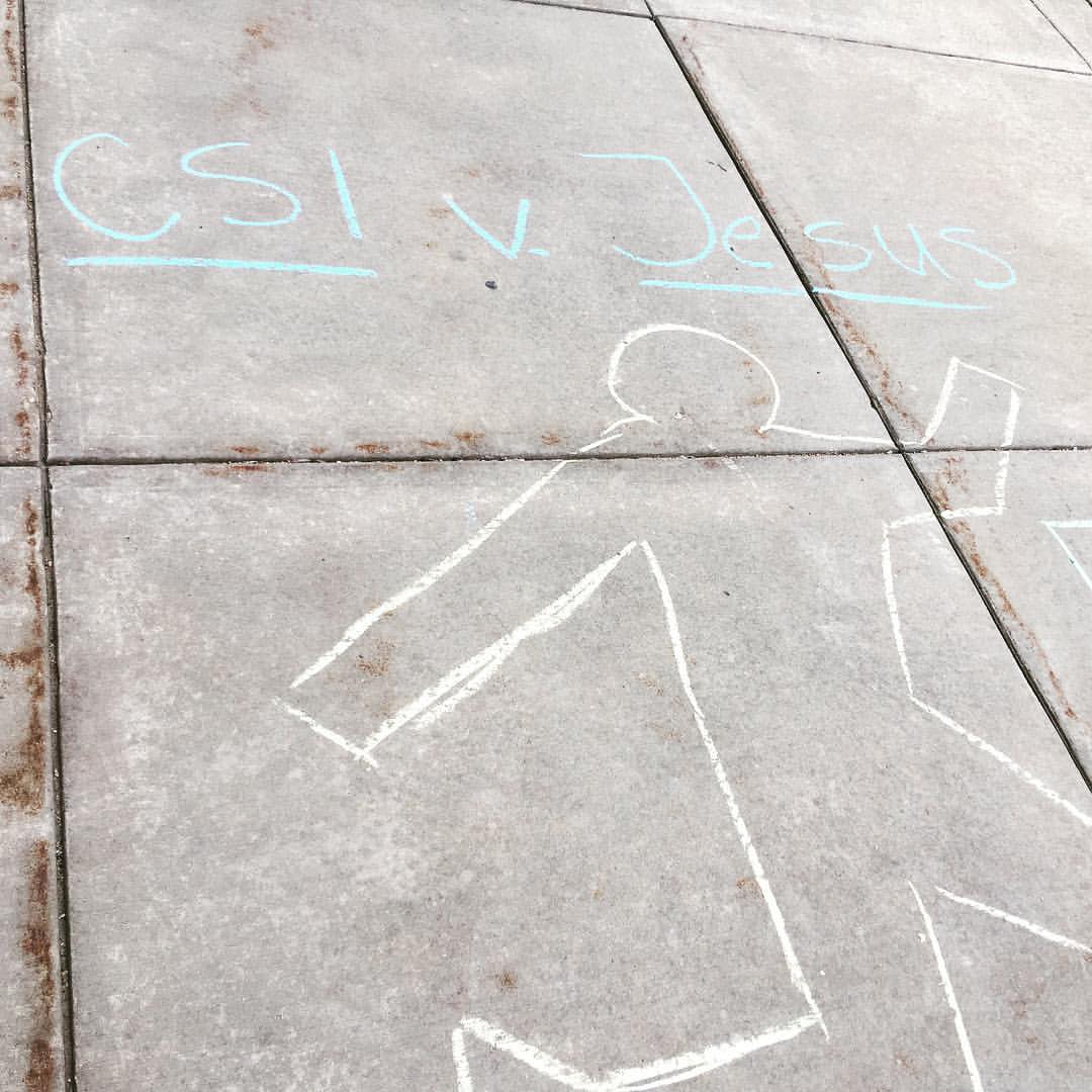 Chalk outline of a person with the words "CSI vs. Jesus" written above it