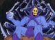 Skeletor sits on a bone throne, holding a small white box