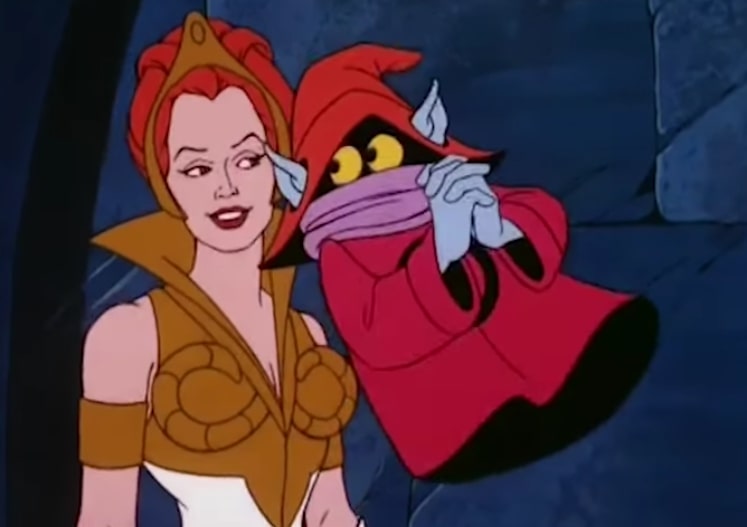 Orko cuddles up to a smiling Teela.