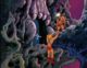 Faker stands over He-Man, who is dangling off the edge of a cliff
