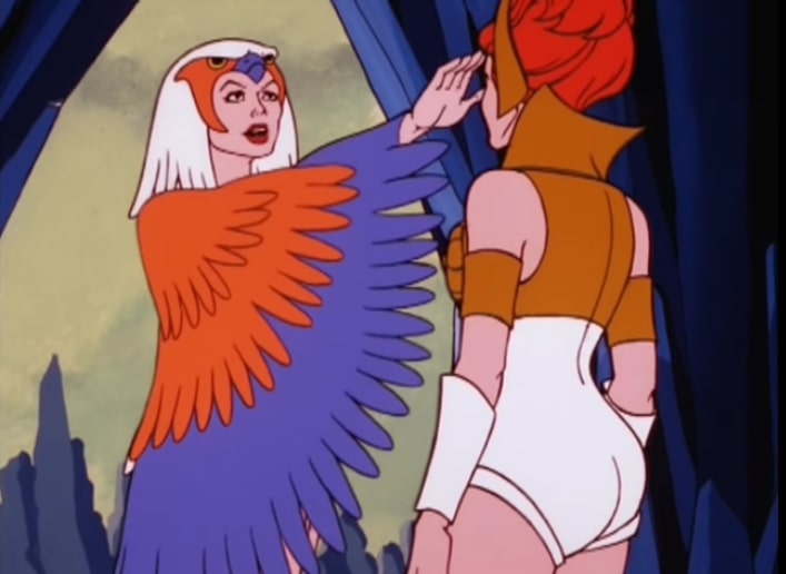 Sorceress puts her right hand to Teela's forehead.