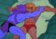 Skeletor tries to push He-Man out of a hole in the side of his ship