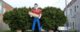 Giant fiberglass statue of a man in a red shirt and blue jeans holding a giant hot dog. (Photo by JymPoiranges via Flickr/Creative Commons https://flic.kr/p/rtLDKX)