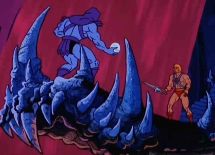 Skeletor holds the Dragon Pearl in his right hand as he faces off against He-Man, who holds his sword