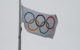 The Olympic flag flies on a pole. (Photo by Ryan Lejbak via Flickr/Creative Commons https://flic.kr/p/RKXqs)
