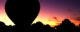 The silhouette of a hot air balloon in front of a sunset - this is not the balloon from the escape flight out of East Germany. (Photo by David Atkinson via Flickr/Creative Commons https://flic.kr/p/6aUU99)