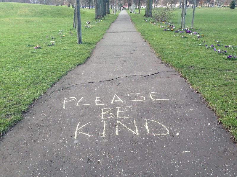 The words "Please be kind" written in chalk on a pathway. (Photo by Mary Hutchison via Flickr/Creative Commons https://flic.kr/p/2iCrUvr)