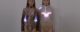 Screenshot from Emotional Clothing Collection video. It shows two women wearing clothes that have lights embedded in them.