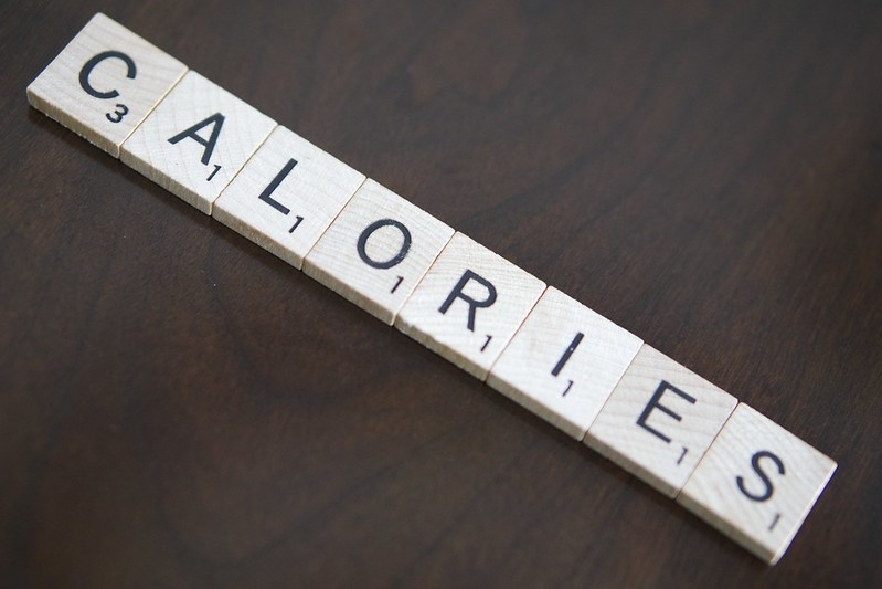 The word CALORIES spelled out in Scrabble tiles. (Photo by Kevin Simmons via Flickr/Creative Commons https://flic.kr/p/SXUptR)