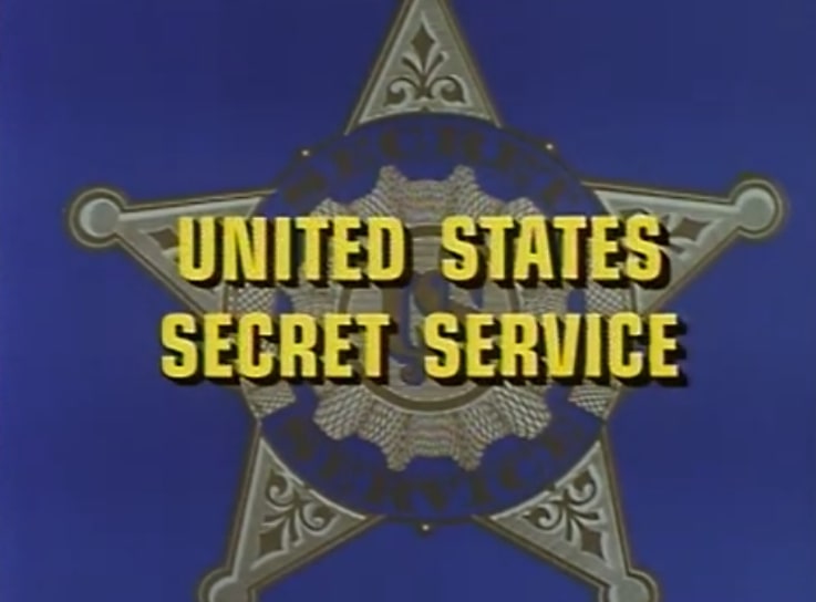 With a badge in the background, the screen shows the words "United States Secret Service" in yellow