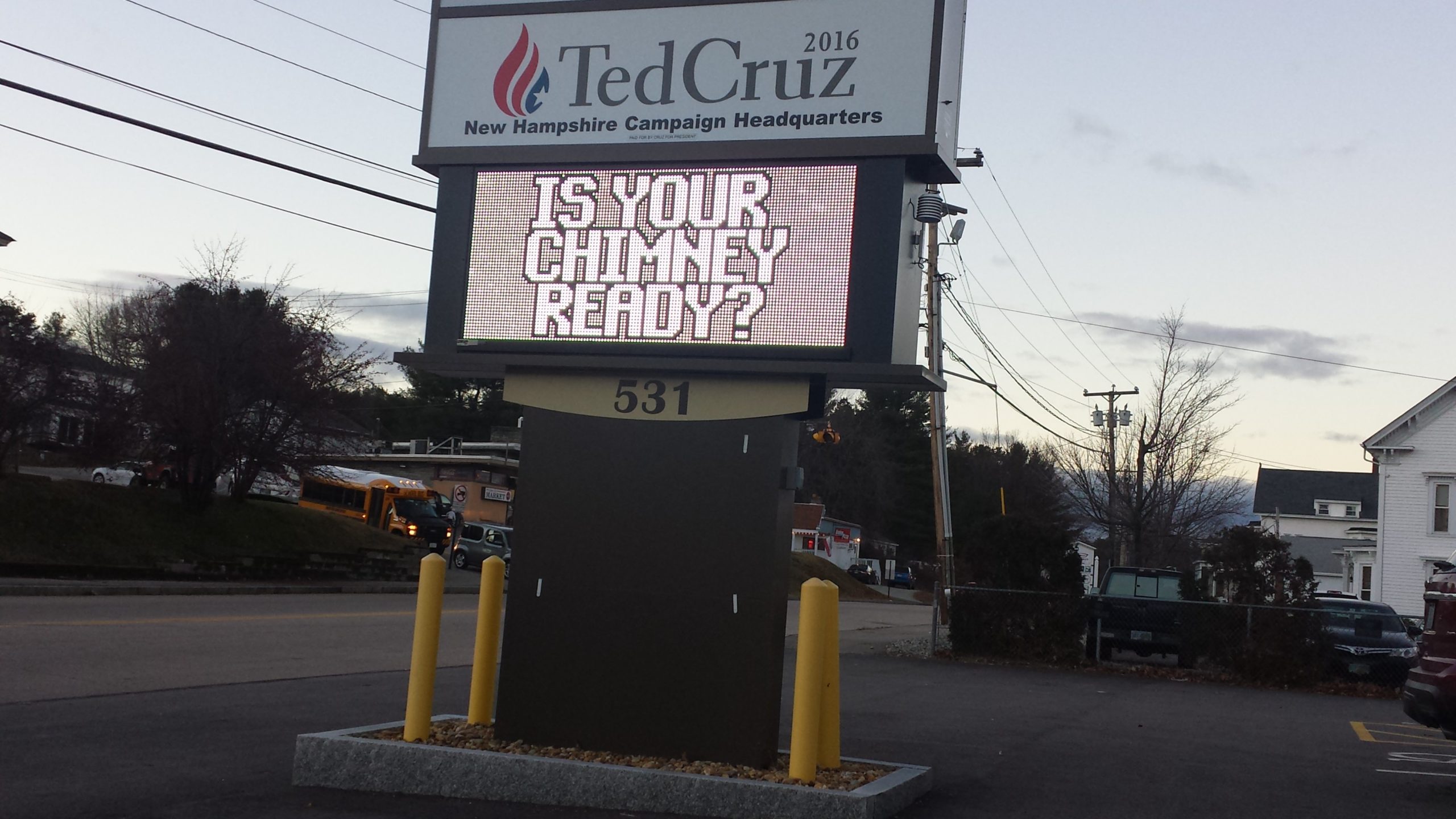 Sign says "Ted Cruz 2016." Underneath another sign says "Is your chimney ready?"